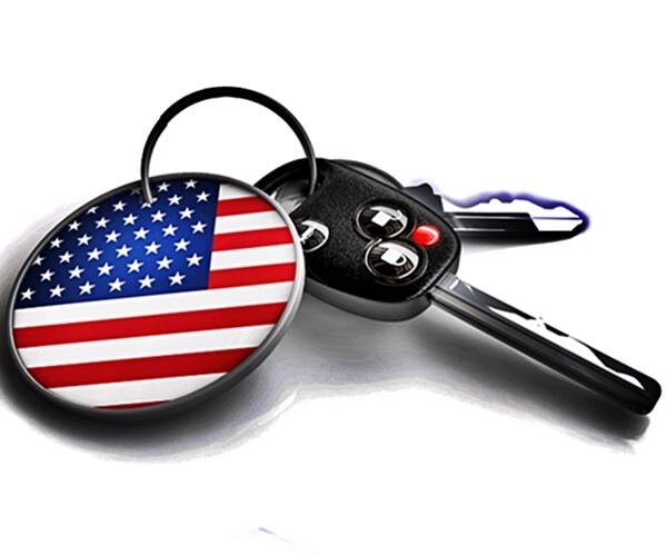 set of car keys with usa flag. concept for vehicles made in the united states. us vehicle industry. 

