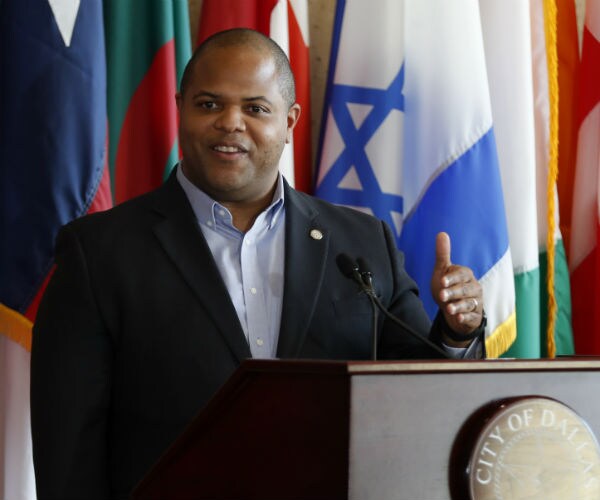 dallas mayor eric johnson gestures with his hands as he speaks