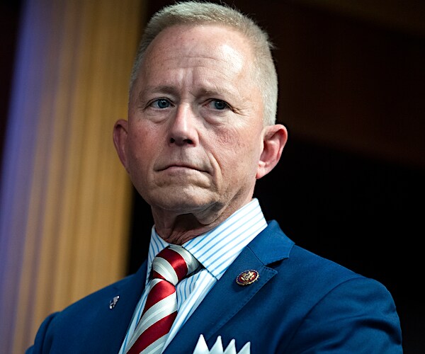 jeff van drew stands silently before a news conference