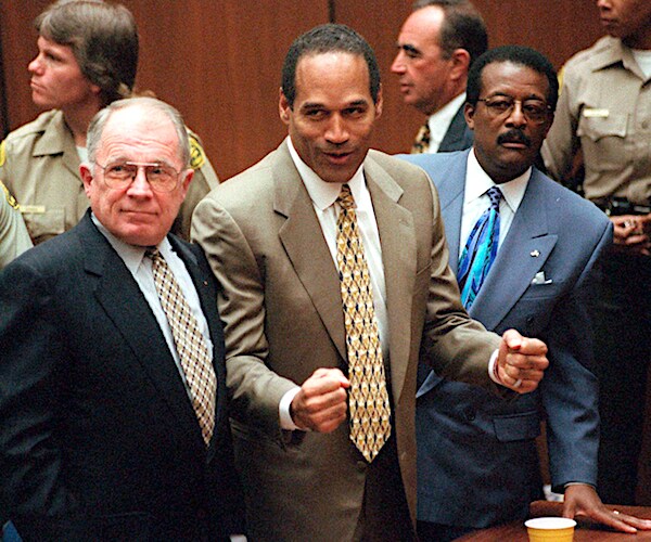 oj simpson pumps his fists as he is acquitted of double murder