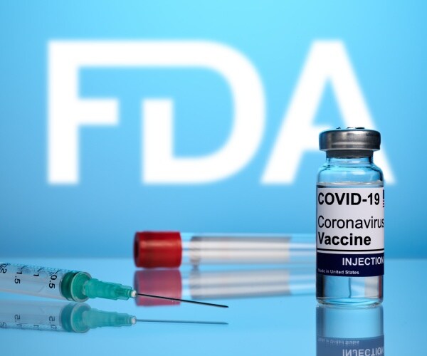 FDA, syringe, vial of COVID vaccine