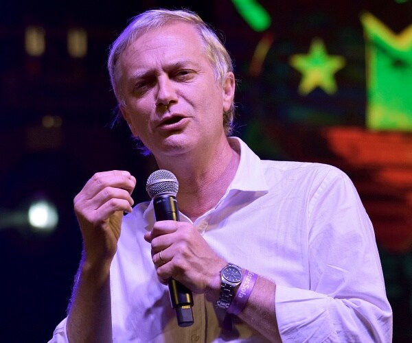 jose antonio kast speaks into mic