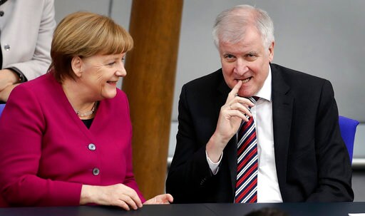 The Latest: Report: German Minister Hints at Compromise