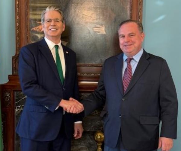 chris ruddy and scott bessent shake hands