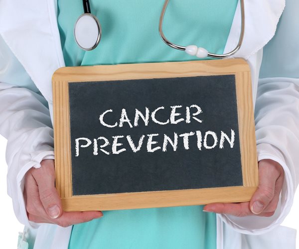 a chalkboard with the words Cancer Prevention written on it