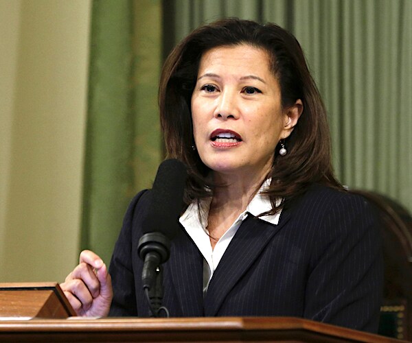 tani cantil-sakauye, who says she is now anti-republican, sits and delivers remarks
