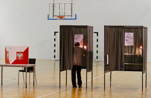 The Latest: Exit Poll: Poland Ruling Party Losing Mayorships
