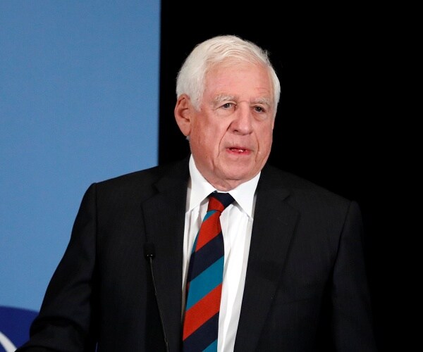 john danforth stands behind podium