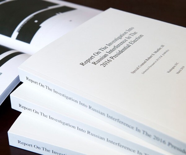 the report on russian interference is piled on a desk