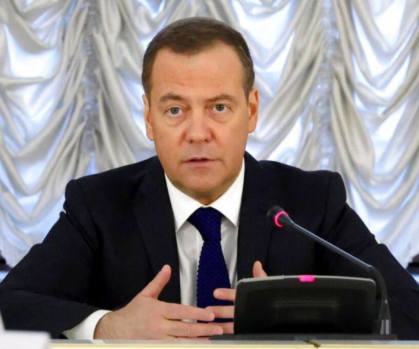 Dmitry Medvedev speaks into a microphone