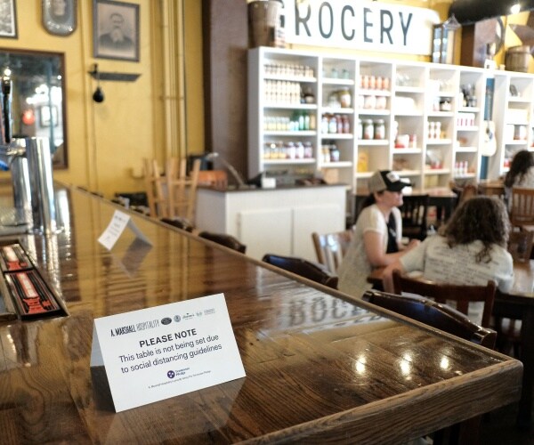 sign says the bar is not open at a grocery store and restaurant