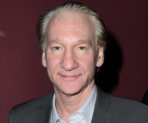 bill maher walks red capet