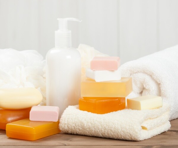 bars of soap stacked on top of eachother and one pump hand soap