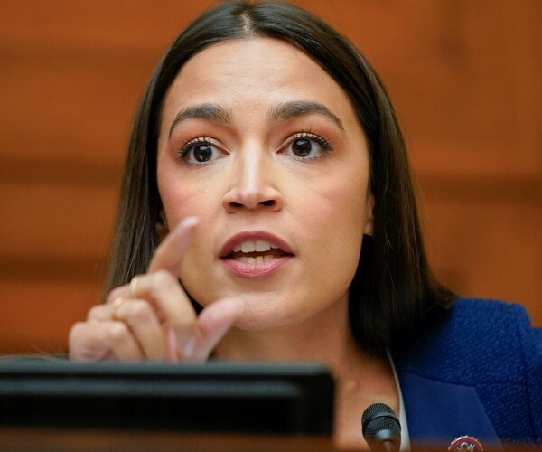 alexandria ocasio-cortez gestures while speaking