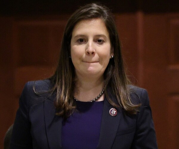 elise stefanik walks down capitol hallway