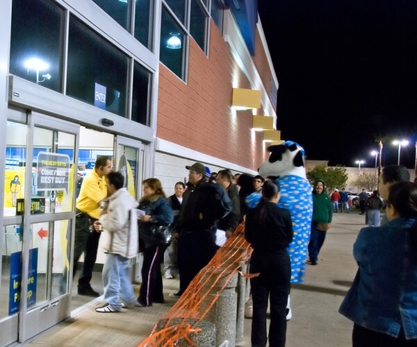 store opens early for black friday sale. people camped out from thanksgiving night first to enter