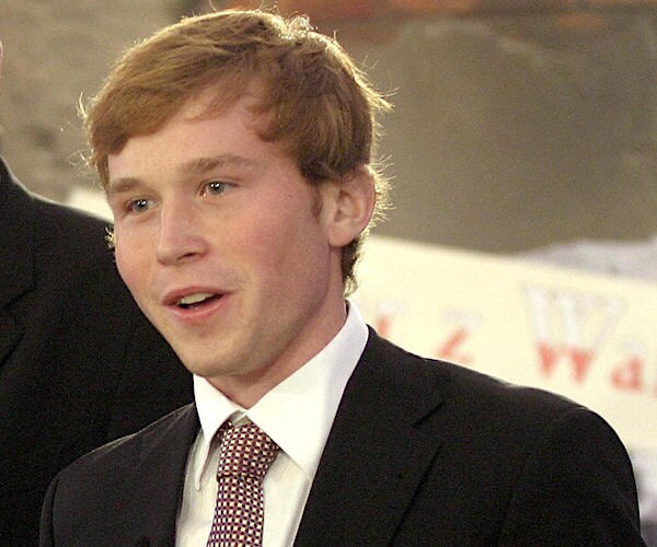 pierce bush smiles wide during a photo session