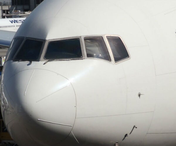 a white airplane's cockpit is shown