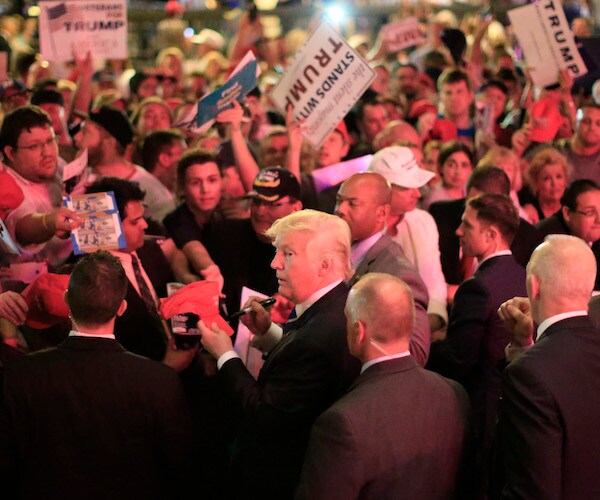 then-candidate donald trump makes his way through a campaign rally crowd