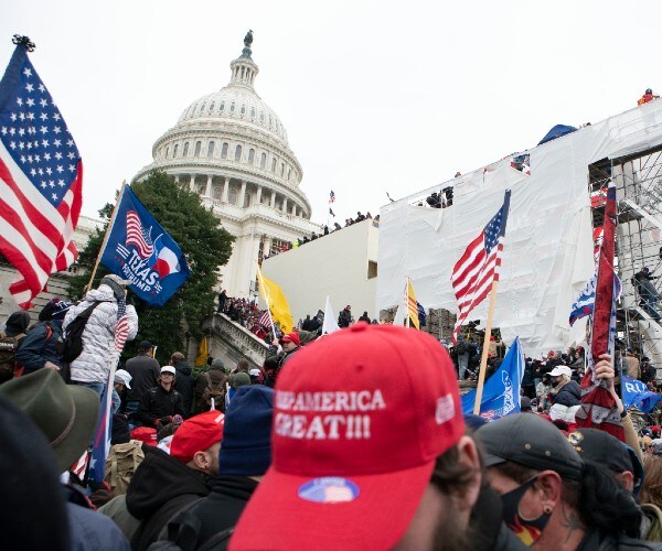 trump rally demonstrators are shown outside the capitol on january sixth