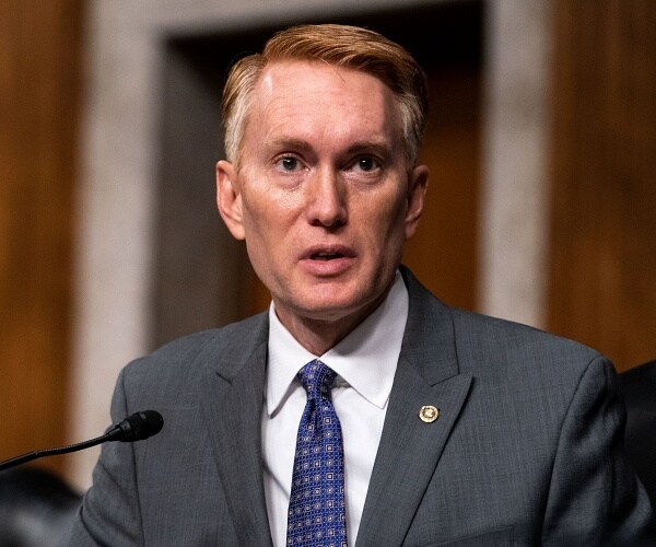 james lankford sits behind microphone