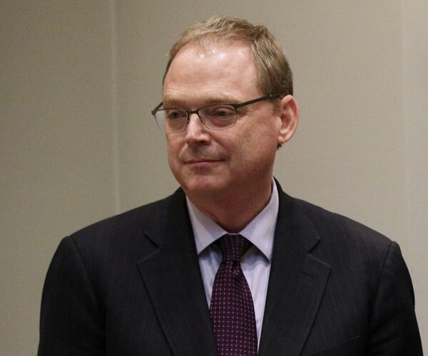 kevin hassett stands with other officials in a white house event