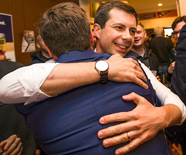 Democratic presidential candidate Pete Buttigieg hugs South Bend, Indiana, Mayor-elect James Mueller