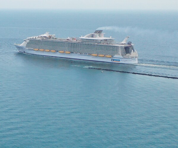 a cruise ship sails in the ocean near miami