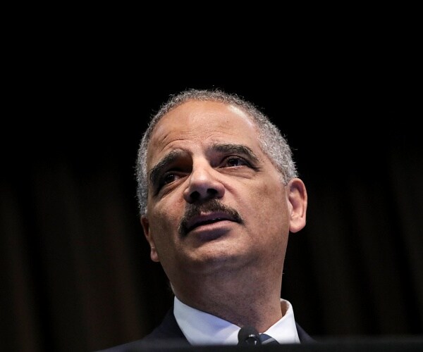 eric holder speaks onstage
