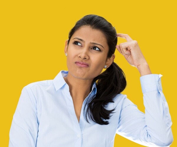 Middle aged woman looking confused/can't remember something