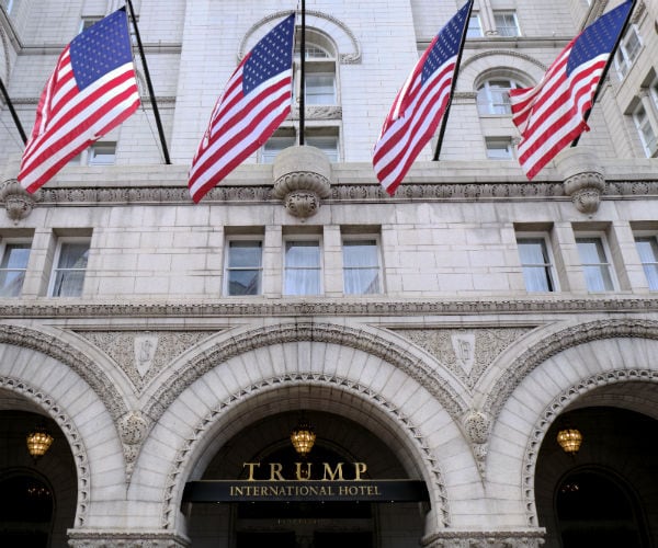 trump international hotel is shown in washington with american flags above the door frame