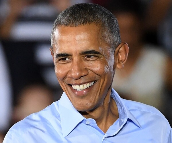 barack obama smiles on stage