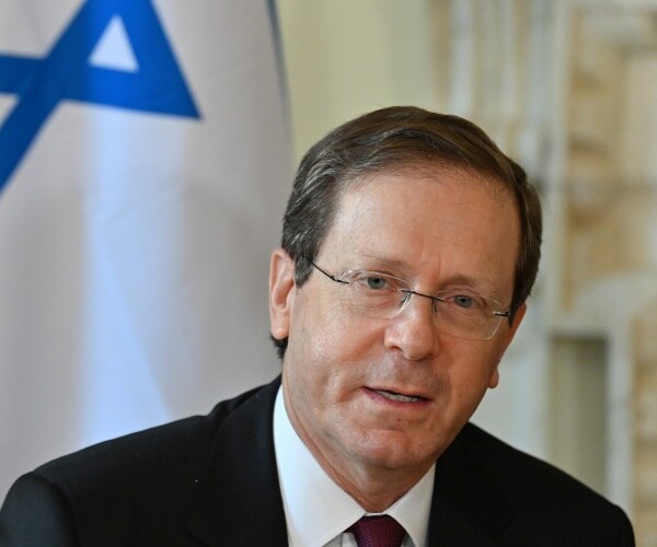 isaac herzog looks on