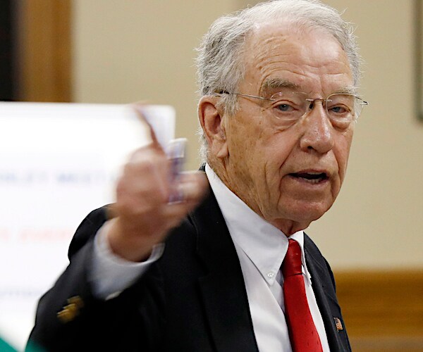 Iowa GOP Sen. Chuck Grassley points while making remarks