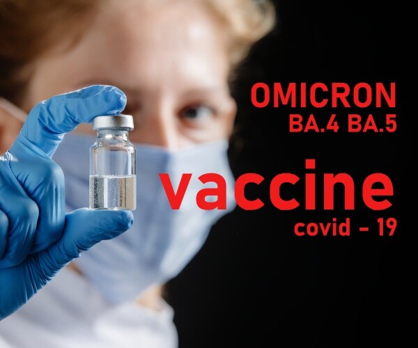 healthcare worker holding up vial of vaccine against omicron BA.4 BA.5 variant