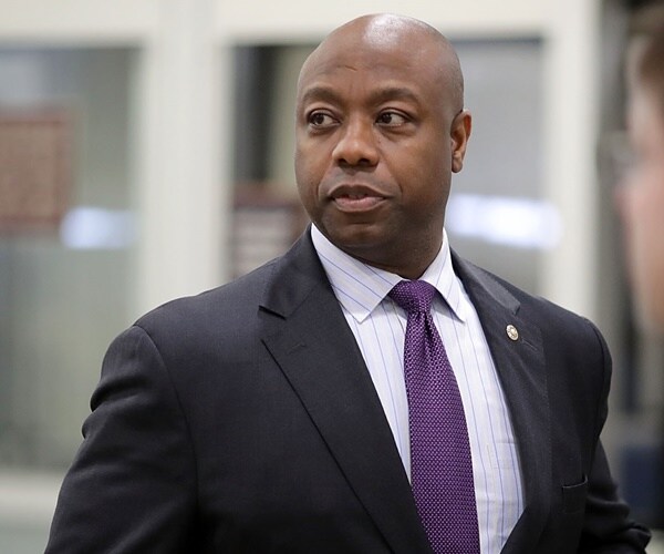 tim scott walks through the halls of congress