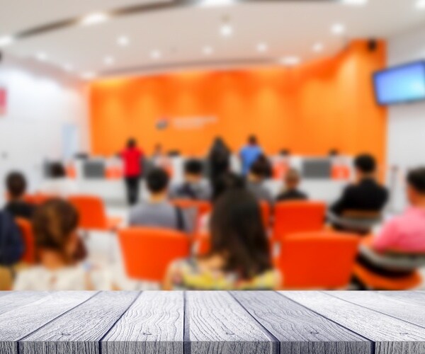 blurred crowded hospital emergency room, people waiting in waiting room