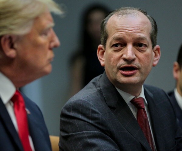 president donald trump looks at secretary alex acosta while he is speaking in the white house