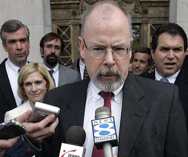 john durham speaks into a gaggle of media mics