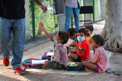 Indian Couple Run Street-side Classes for Poor Students