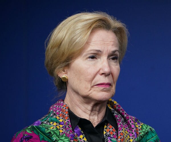 dr. deborah birx is seen wearing a colorful scarf, displaying a serious look