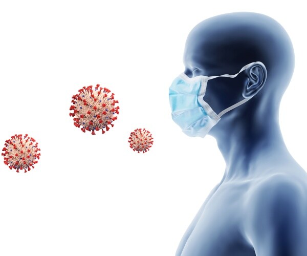 person/dummy head with mask and particles in air