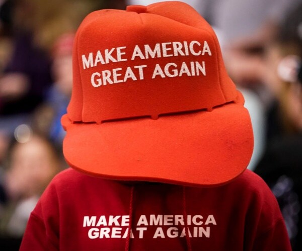 red make america great again hat sits atop red make america great again sweatsuit