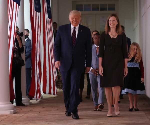 donald trump and amy coney barrett walk to rose garden