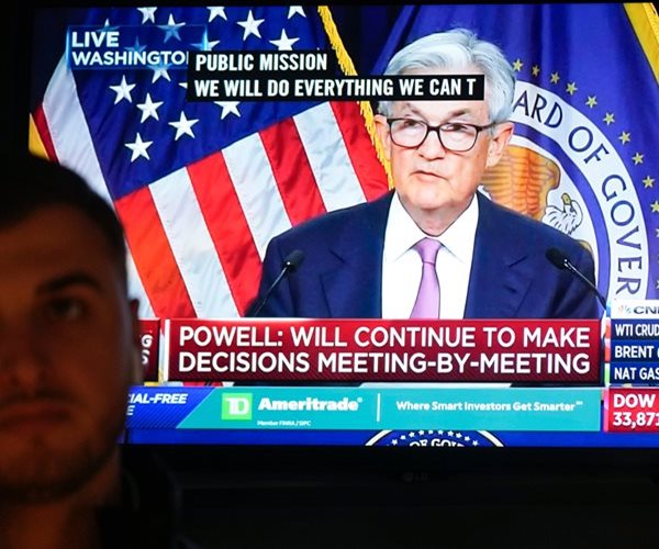 Stocks End Mixed After Fed Signals More Hikes to Come