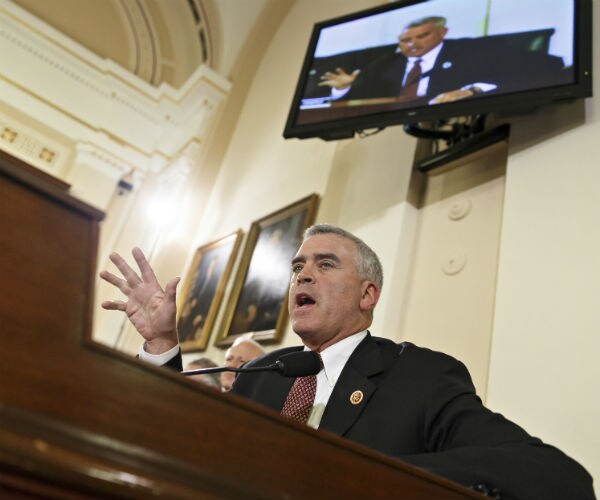 brad wenstrup speaking at a podium