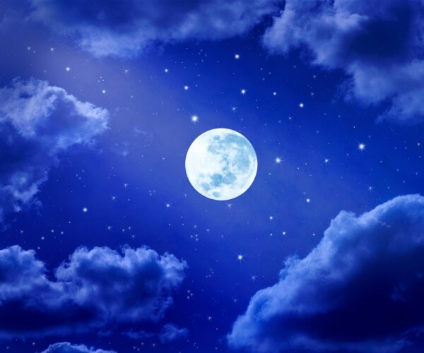 night sky with stars clouds and the full moon