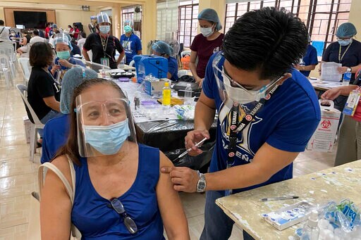 Thousands Jam Philippine Vaccination Sites over False News