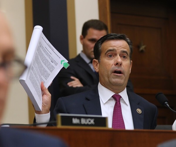 john ratcliffe holds up a report and questions robert mueller