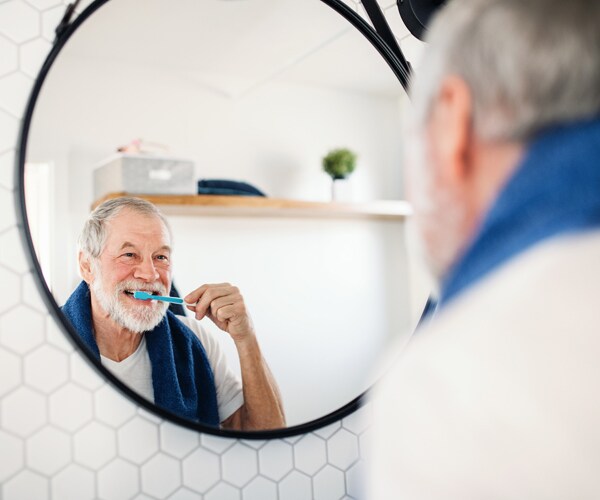 a man brushing his teeth